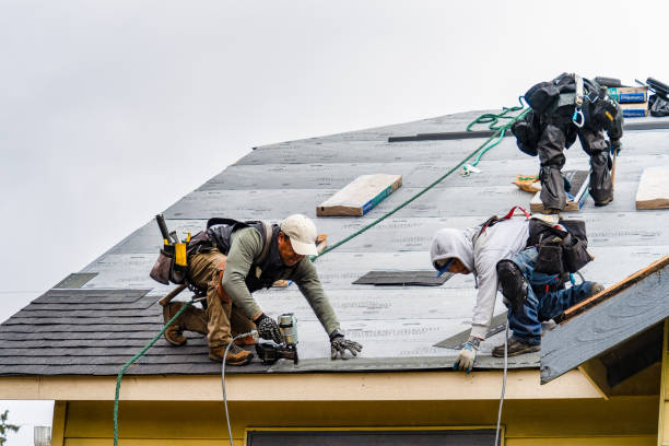 Professional Roof Replacement technician working in Santa Claus, IN